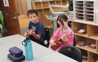 Students practice ukulele lessons